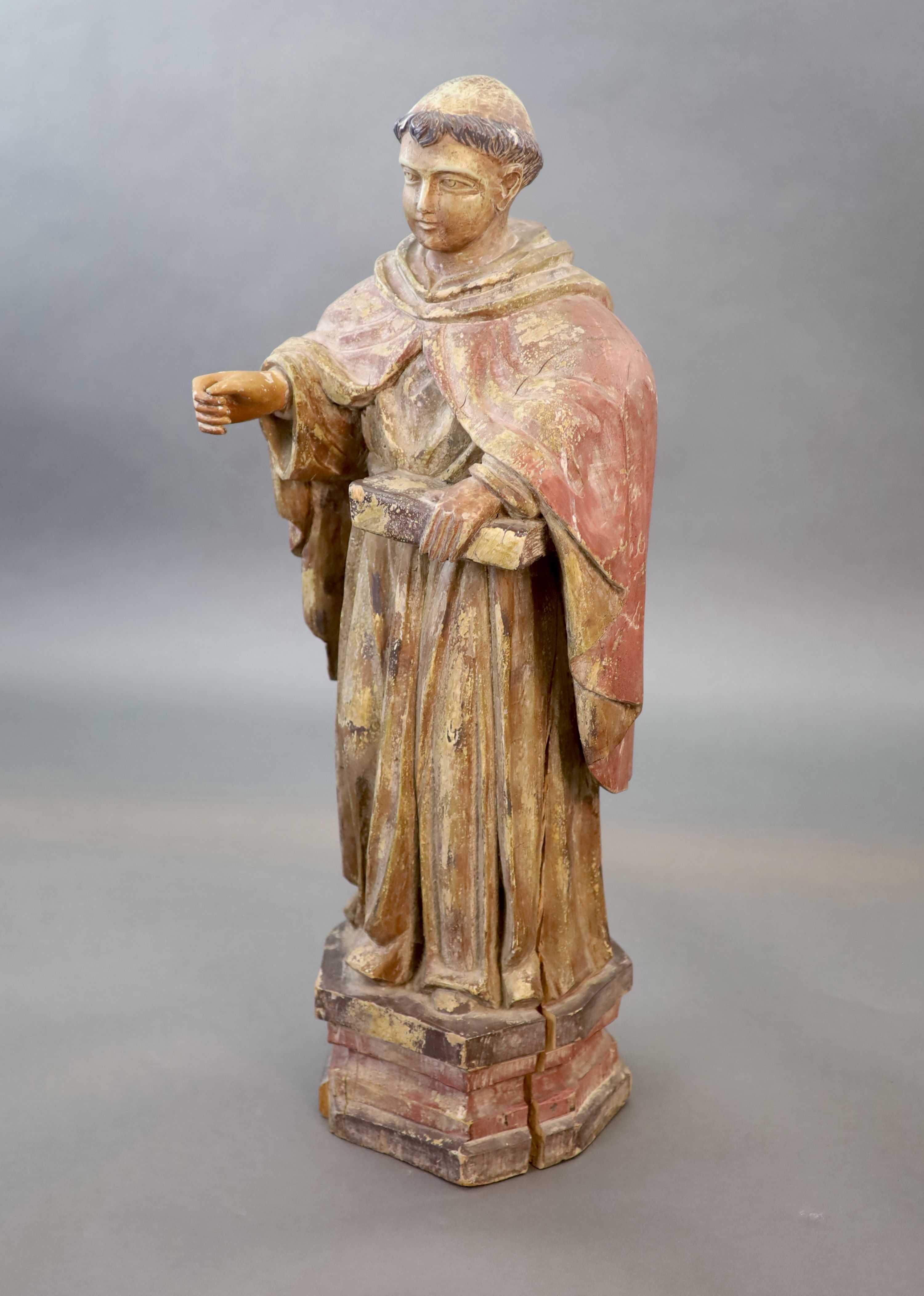 A large carved hardwood study of a standing monk or Saint, early 20th century 102cm high